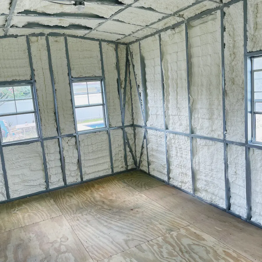 Closed-cell spray foam insulation applied to wall cavities in a residential project in August